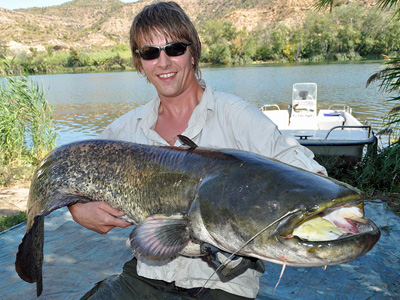 Andrew shows off his 66lb catfish, his first and largest of the week