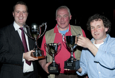 Michael Fitzsimons of Failte Ireland (L) presents Joe McEntegart (centre) and his boat mate Brian Connell (R) with the Pike Fishing World Cup. 