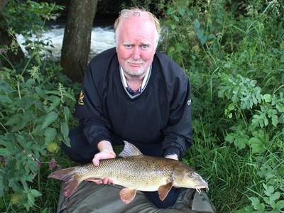 Robert finally got his barbel by bouncing meat in the weirpool