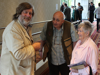 Des Taylor (L) talking to Peter Wheat and his wife