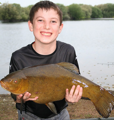 Not just carp - one happy lad with a big tench