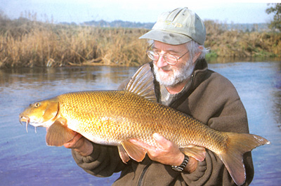 Terry in familiar pose - with a 14lb plus Stour barbel