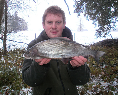 Snow on the ground and a huge grayling, angling doesn't get much better than this...