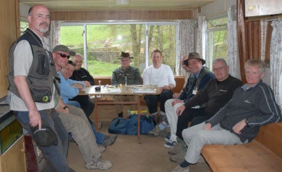 Gathering round for the fly tying in the caravan