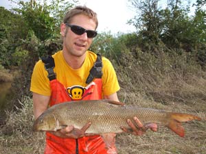 Jim with a 10lb 14oz barbel and his own take on Realtree