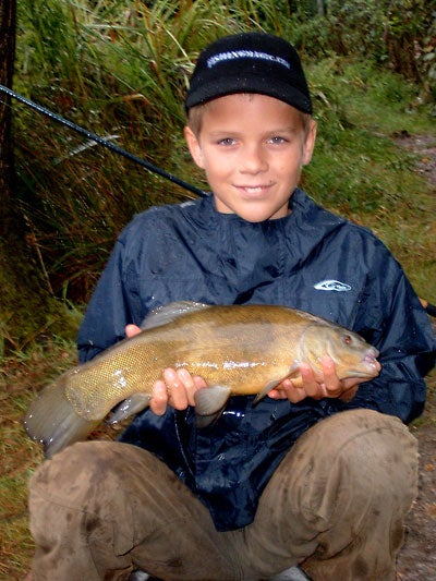 Connor with a nice tench from last year