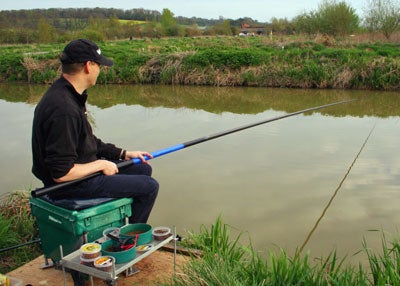 Mark fishing the long pole at full length and demonstrating one method of holding it
